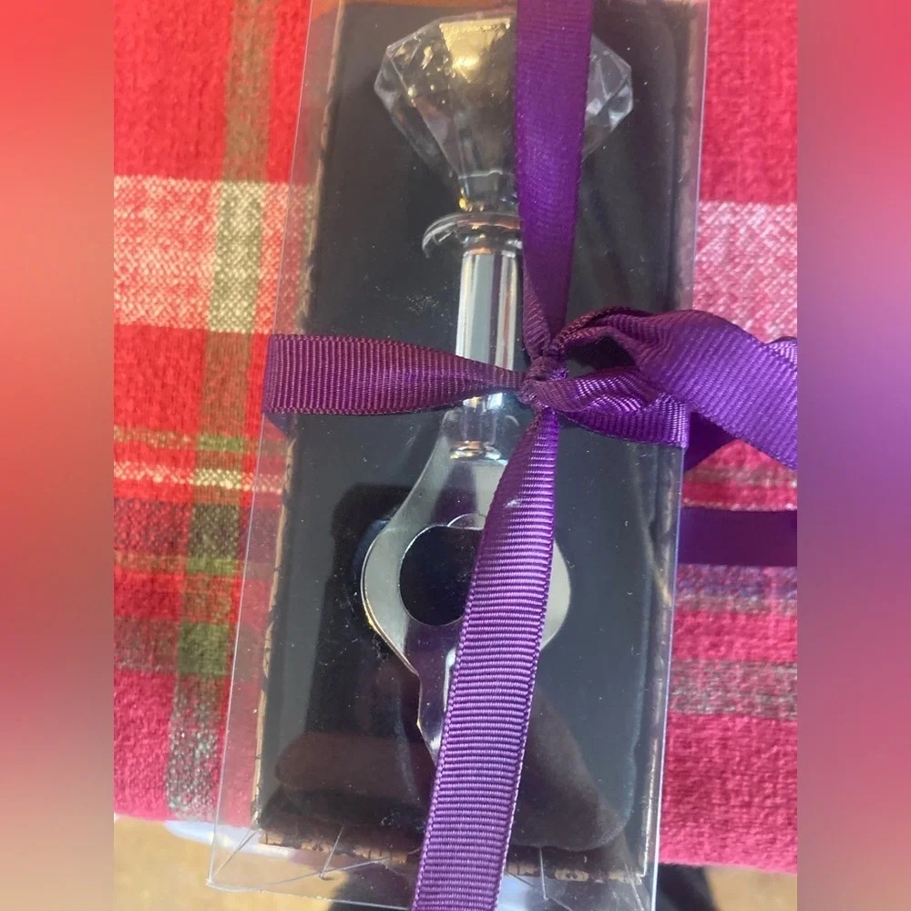 Faux diamond bottle opener. New in box. Super cute & Would make a great gift